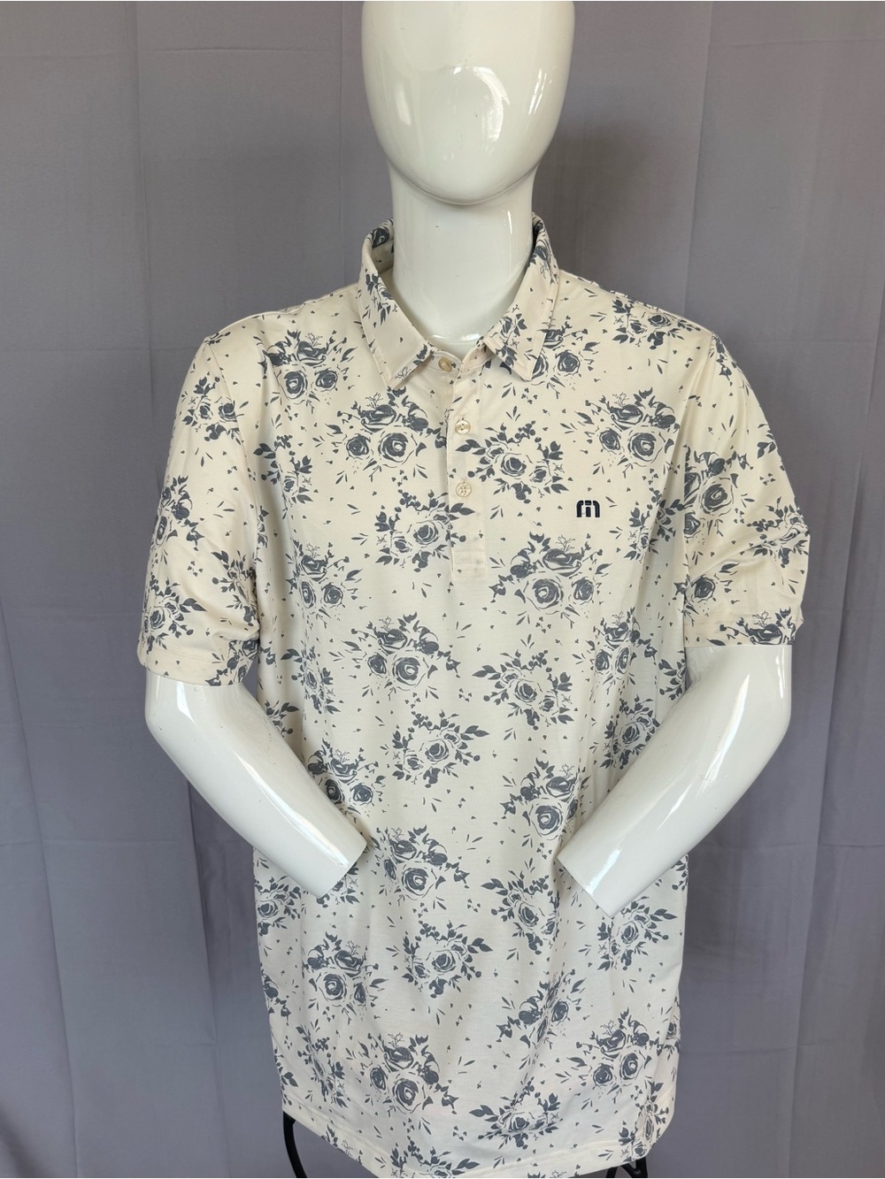 TravisMathew Cream Polo with Gray Floral Print